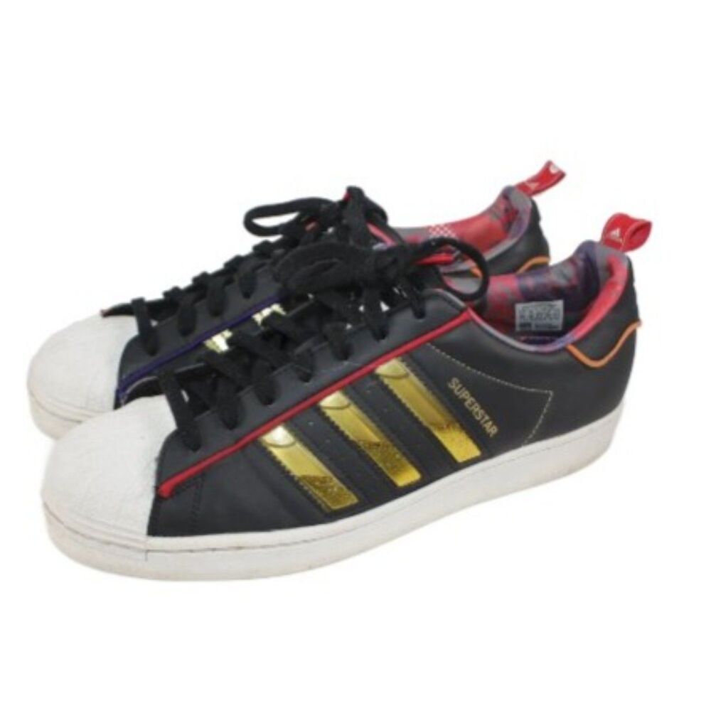 adidas Black Sneakers with Gold Stripes and Red Trim